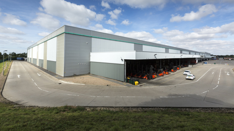 High-spec UK logistics warehouse with covered loading bays, service yard and on-site operations
